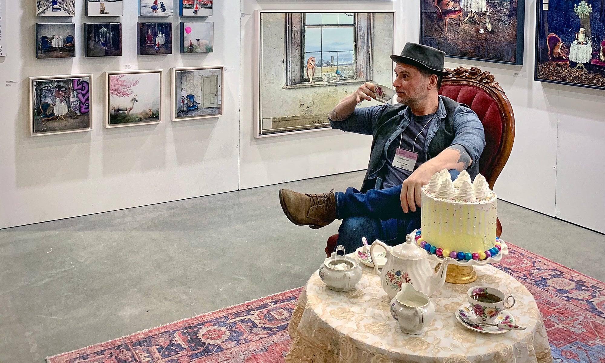 Morgan Jones sitting at a gallery sipping tea.